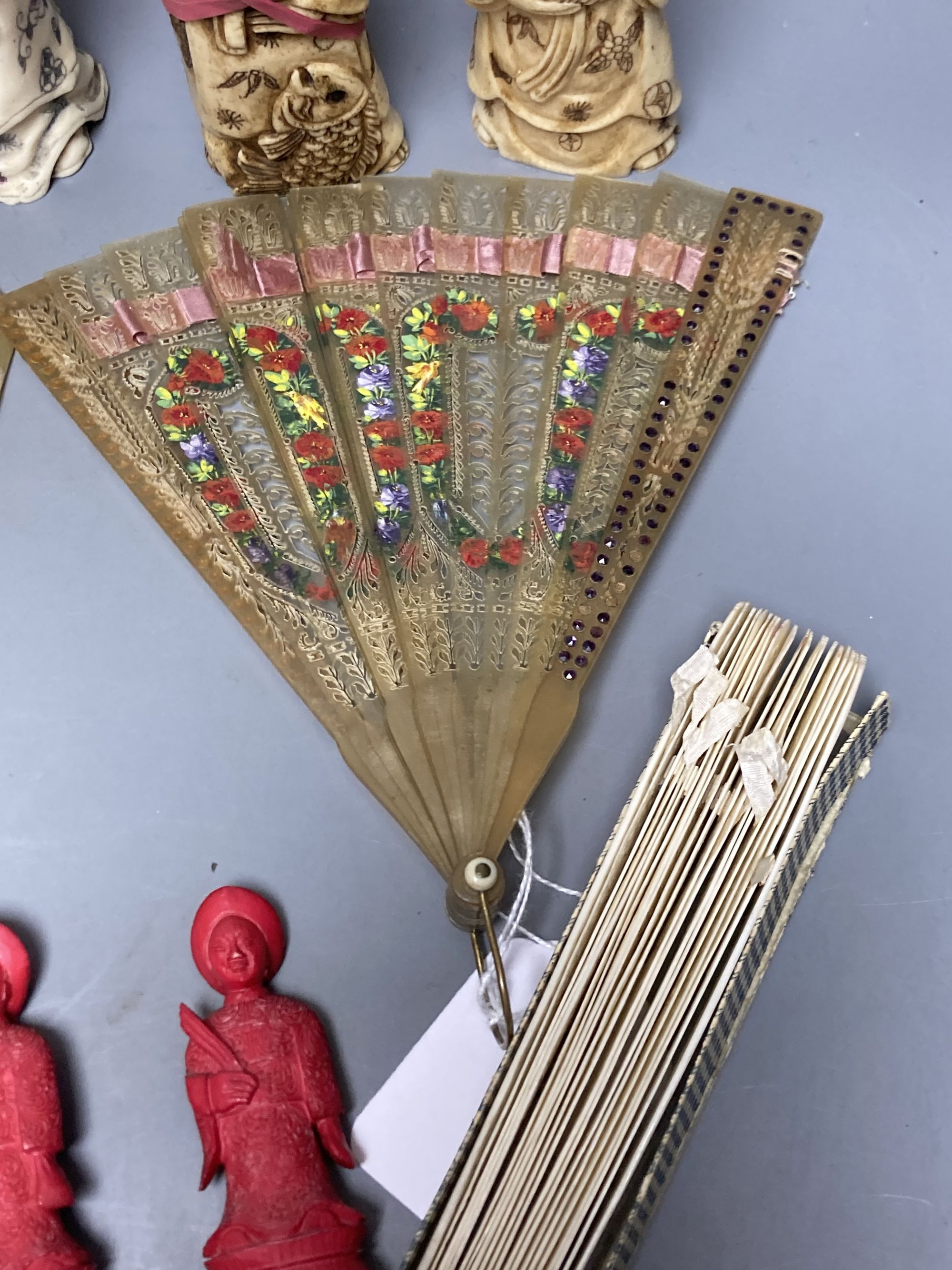 A quantity of bone and ivory carvings including fans and figures